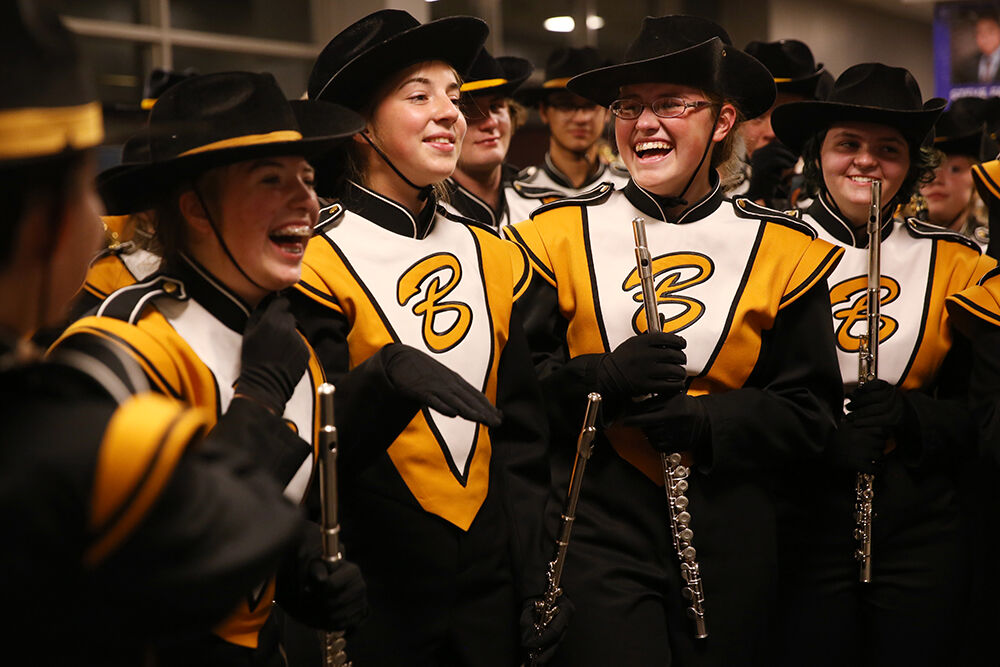 Evelynne Conklin, right, laughs with Elizabeth Farris and the rest of the flute section